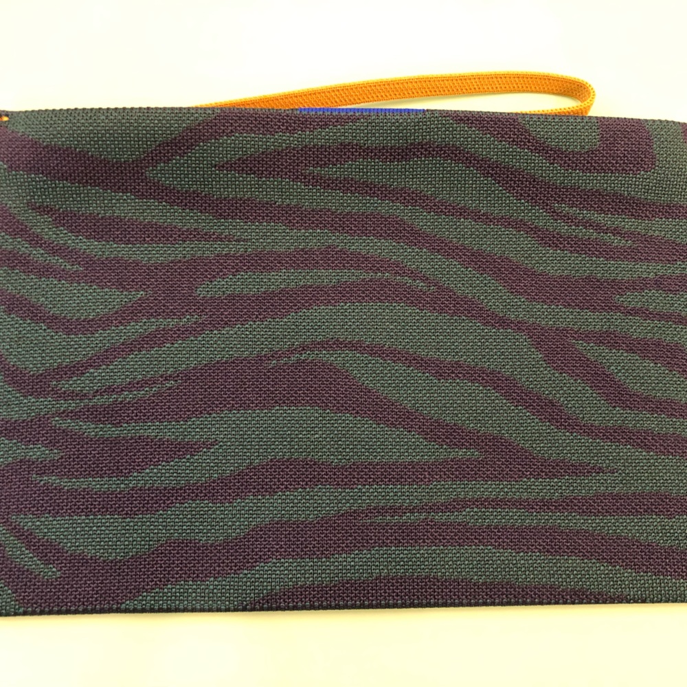 Rothy’s green zebra essential pouch